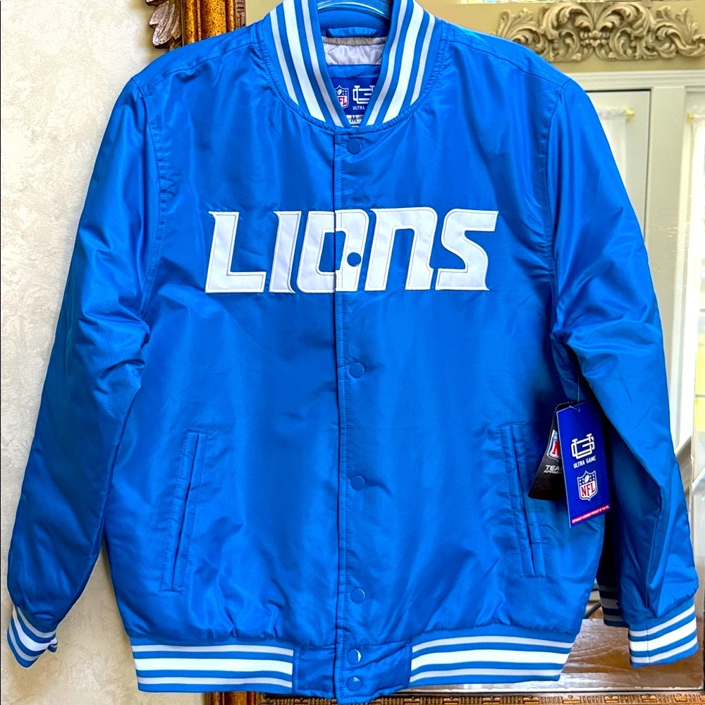 NFL Detroit Lions Blue Varsity Jacket. Size M. Snap front. Two outside pockets.